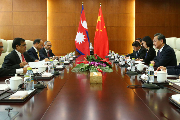 Chinaâ€™s Foreign Minister Wang Yi (right) speaks with Nepal Premierâ€™s special envoy Krishna Bahadur Mahara, left, during their meeting at the Ministry of Foreign Affairs in Beijing, China, on Tuesday, August 16, 2016. Photo: Wu Hong, Pool Photo via AP