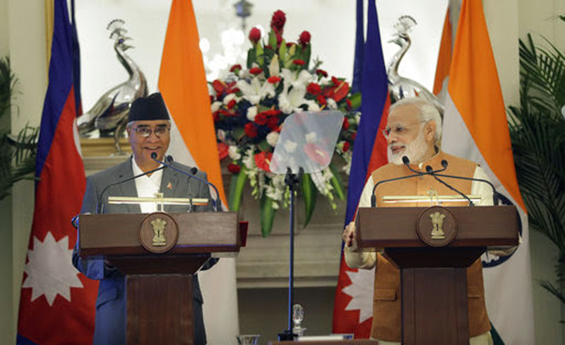 Indian Prime Minister Narendra Modi, right, makes a media statement with his Nepalese counterpart Sher Bahadur Deuba after their delegation level meeting in New Delhi, Thursday, August 24, 2017. Photo: AP